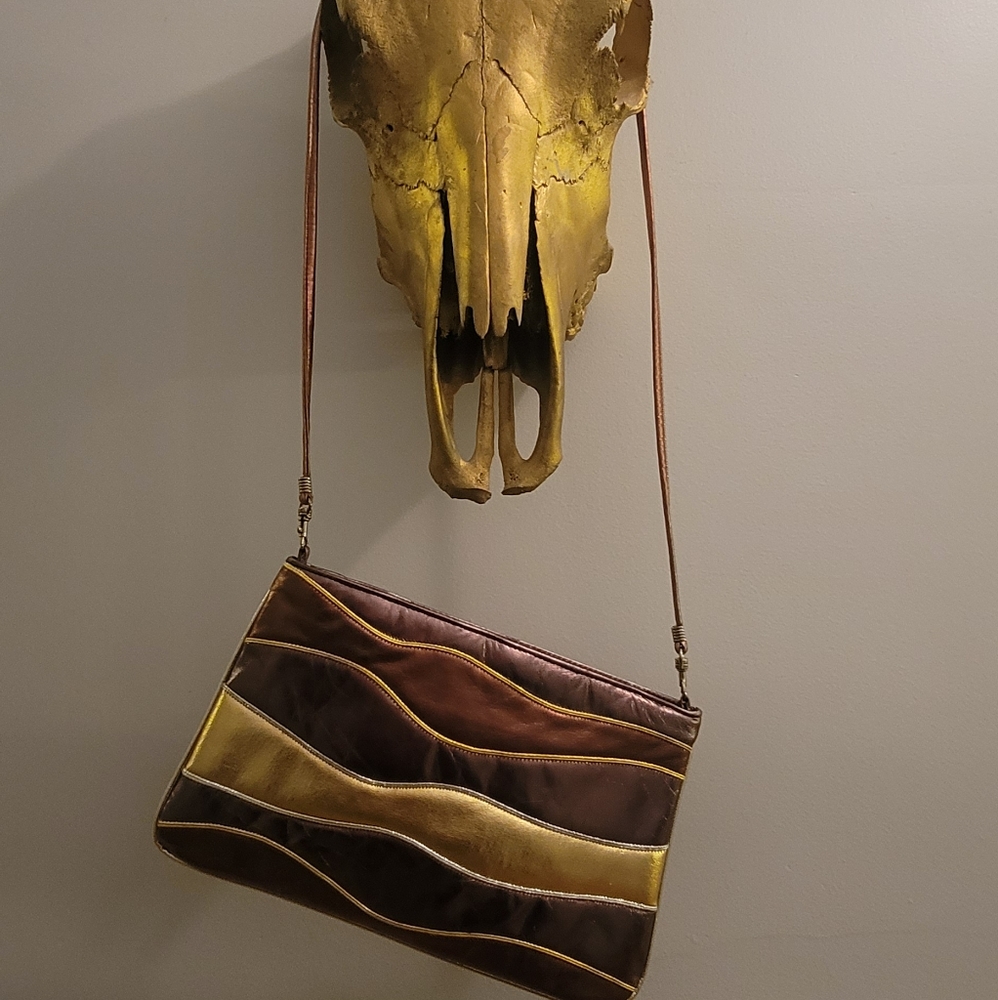 Leather, Metallic Park Avenue International crossbody purse.